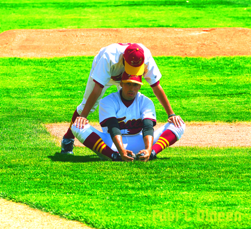 Stretching In The Outfield. Image Credit: Paul DiNeen